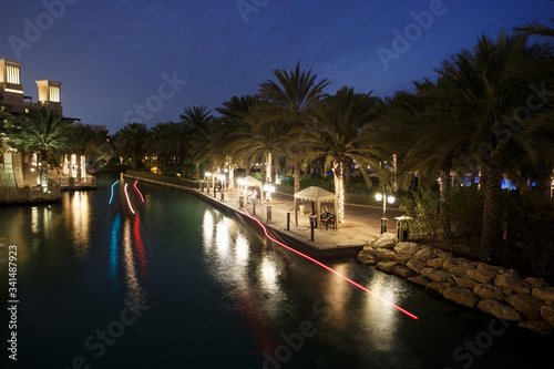 DUBAI, UAE -: Night view of Madinat Jumeirah hotel, Dubai, UAE. Madinat Jumeirah - luxury 5 star hotel with own artificial canals and boats.