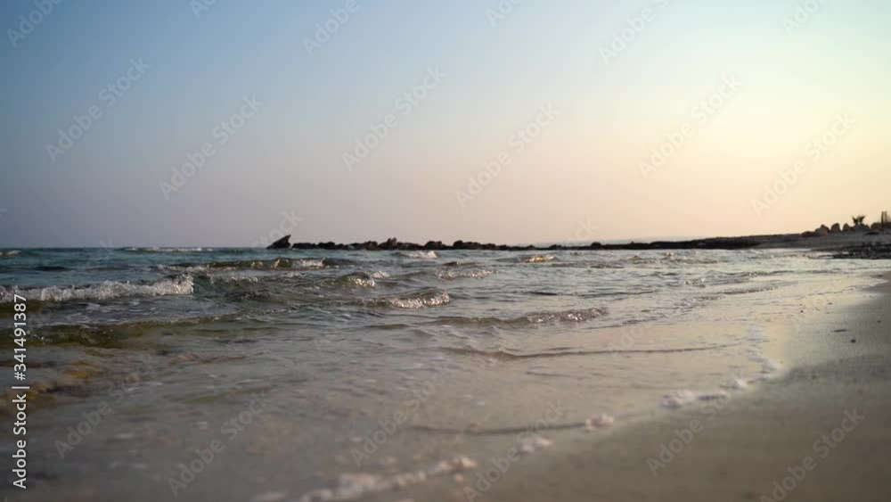 Sea waves slow motion during the beautiful sunset in hot island. Sea waves slow motion during the beautiful sunset in hot island.