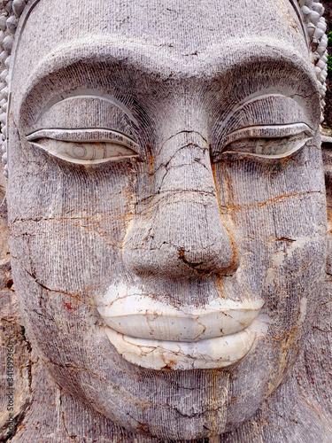 Buddha face carved in stone
