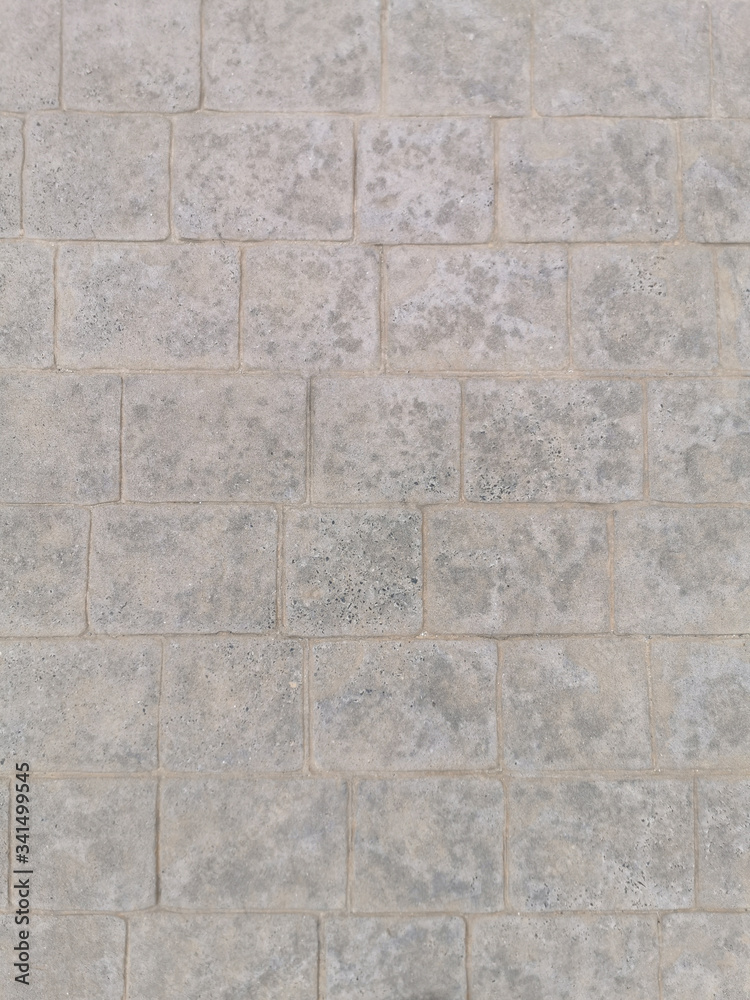 gray concrete wall lined on tiles for background and texture gray concrete wall lined on tiles for background and texture