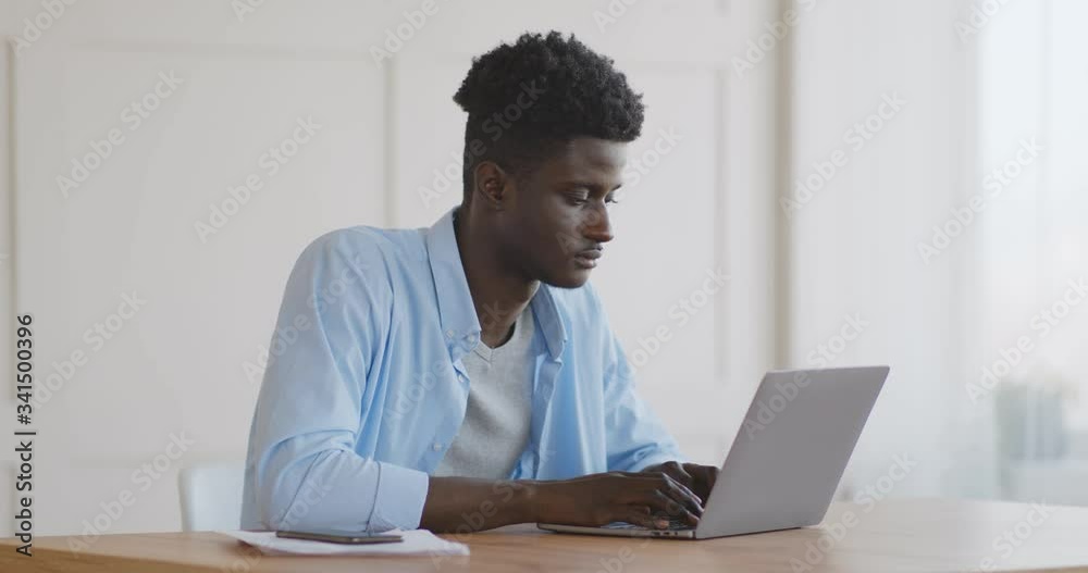 Young african american manager relaxing at workplace Young african american manager relaxing at workplace