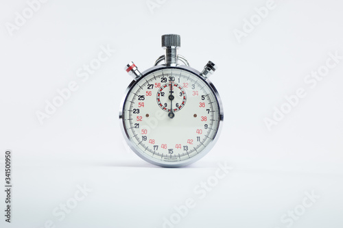 Analogic vintage chronometer clock with red and black numbers on white background