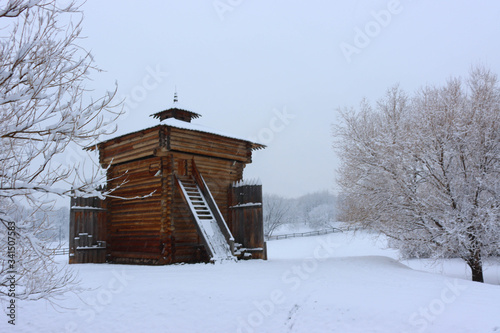 Museum of wooden architecture in Kolomenskoye during snowfall. Tower of the Bratsk fortress in Kolomenskoye estate, Moscow, Russia