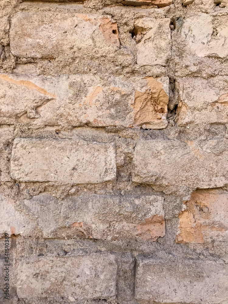 Fragment of an old brick wall. Background, brick texture Fragment of an old brick wall. Background, brick texture
