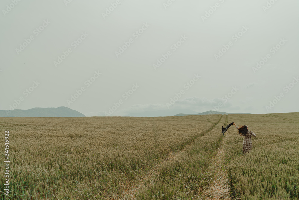 Beautiful woman wheat fields windy day Beautiful woman wheat fields windy day