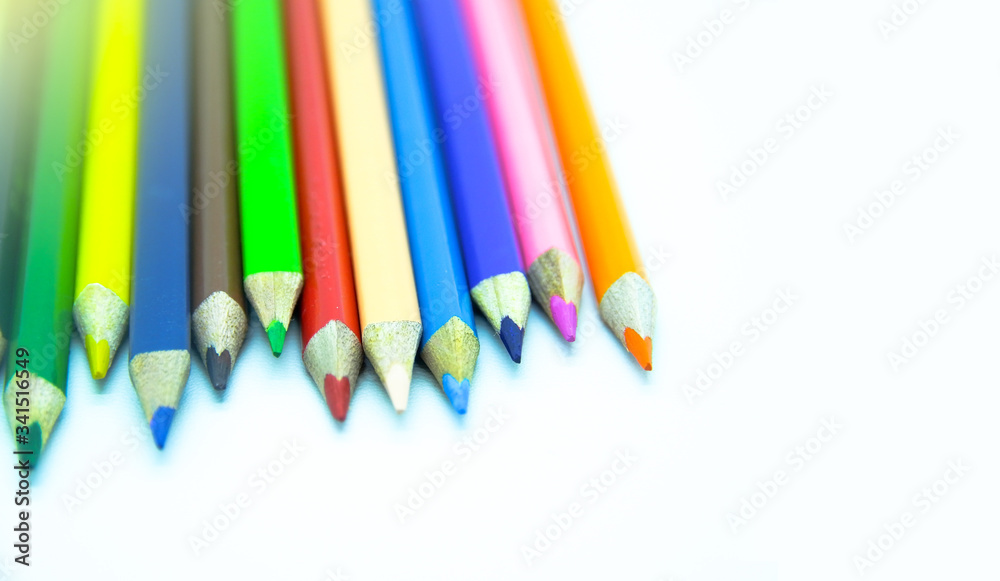 Photo of arrangement of color pencils isolated on white background. Blank space for text. Flat lay. Close up. Top view. Leadership business concept. School concept. Rainbow color pencil. Photo of arrangement of color pencils isolated on white background. Blank space for text. Flat lay. Close up. Top view. Leadership business concept. School concept. Rainbow color pencil.