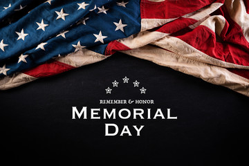 Happy Memorial Day. American flags with the text REMEMBER & HONOR against a blackboard background. May 25.