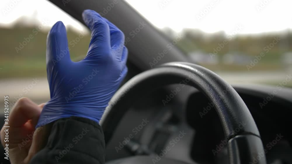 Driving a Car in Protective Surgical Gloves During Virus Outbreak Driving a Car in Protective Surgical Gloves During Virus Outbreak