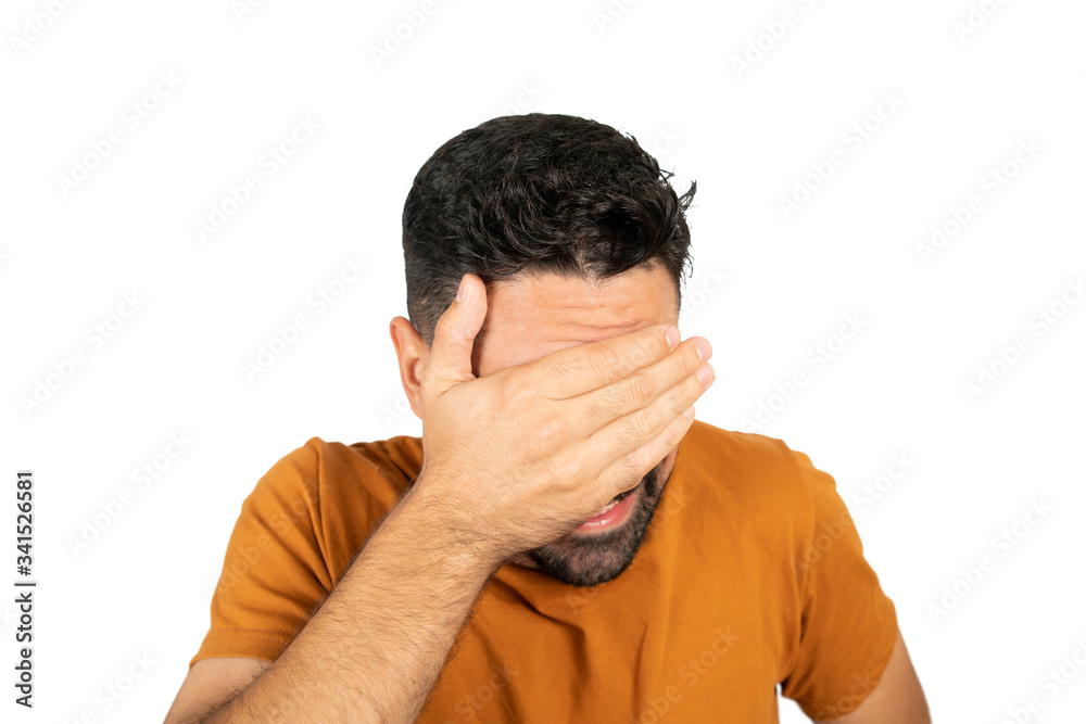Portrait of young man looking scared.