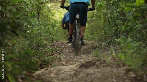 Two men mountain biking in El Salvador.
