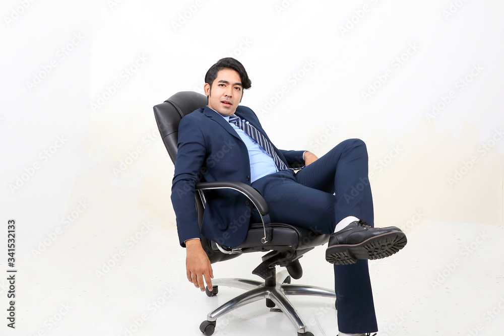 South east Asian Malay Man facial expression sit on chair serous South east Asian Malay Man facial expression sit on chair serous