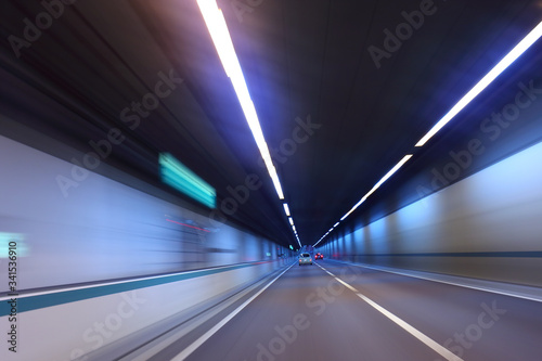Car traffic in highway road tunnel