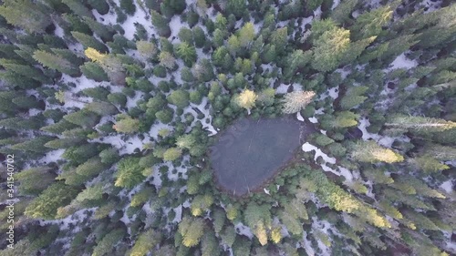 Mt Jefferson is Oregon's second tallest mountain. Mount Jefferson Wilderness Area, Oregon
Aerial view, pine forest, river and pond with snow in spring time. Start touristic season. Beautiful sunny day photo