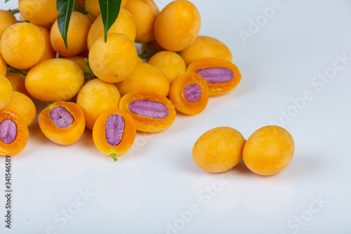 Fresh sweet yellow Marian plum thai fruit isolated on white background © artit