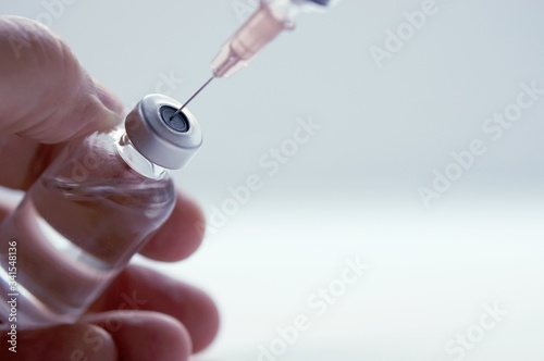 Vaccine vial dose flu shot drug needle syringe,medical concept vaccination hypodermic injection treatment disease care hospital prevention immunization illness disease baby child photo