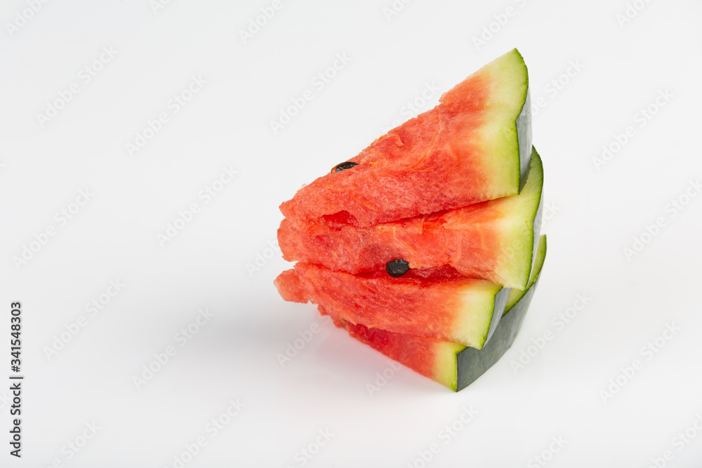 Freshly sliced red watermelon on a white background Freshly sliced red watermelon on a white background