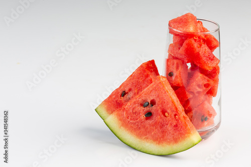Freshly sliced watermelon juice on a white background
