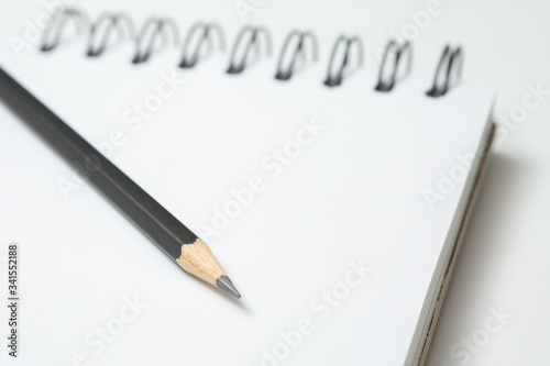 Selective focus of Pencils and notepads on white background