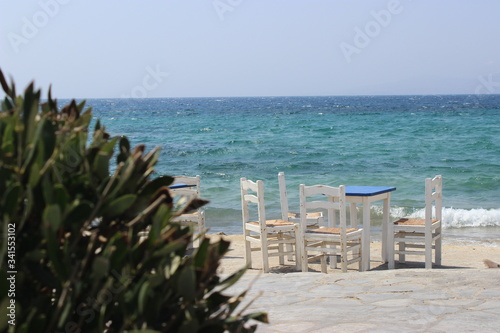chairs an table by the sea of mykonos