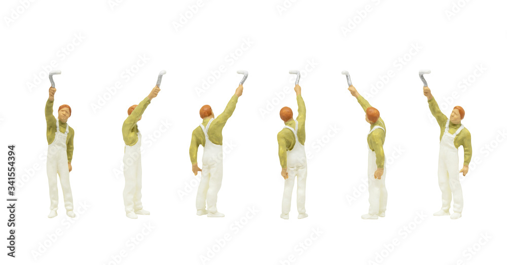 Miniature people character as painter standing and working in posture isolated on white background. Miniature people character as painter standing and working in posture isolated on white background.