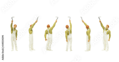 Miniature people character as painter standing and working in posture isolated on white background.