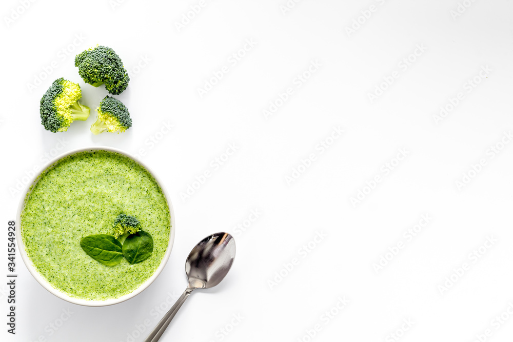 Green vegetable cream soup - broccoli - on white kitchen table top view copy space Green vegetable cream soup - broccoli - on white kitchen table top view copy space