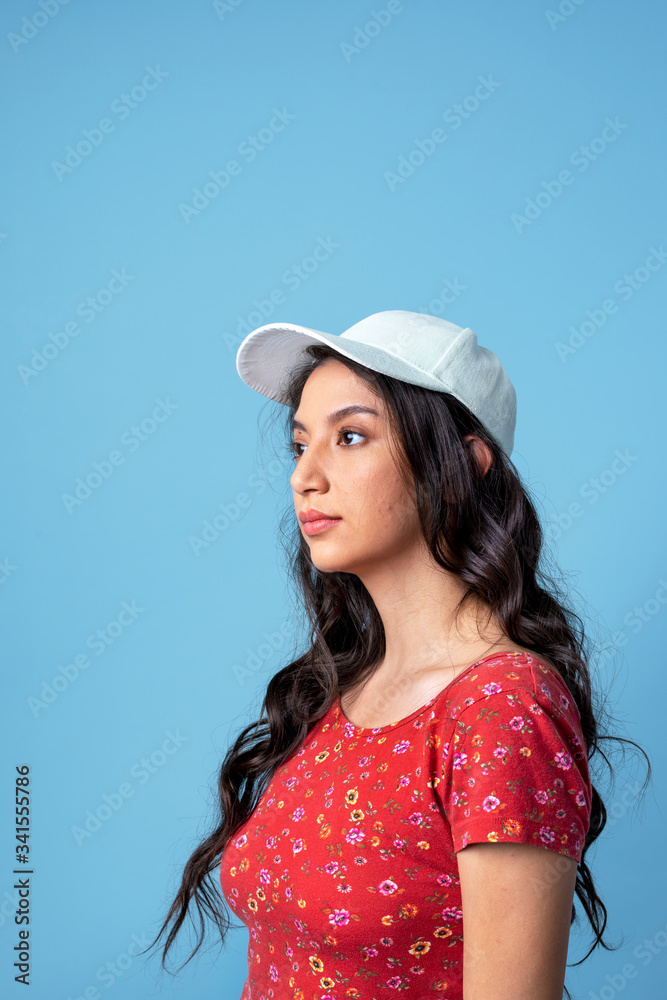 Woman wearing a white cap isolated on background Woman wearing a white cap isolated on background