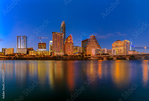 Downtown view across Lady Bird Lake or Town Lake on Colorado River at sunset golden hour in Austin, Texas, USA © SvetlanaSF