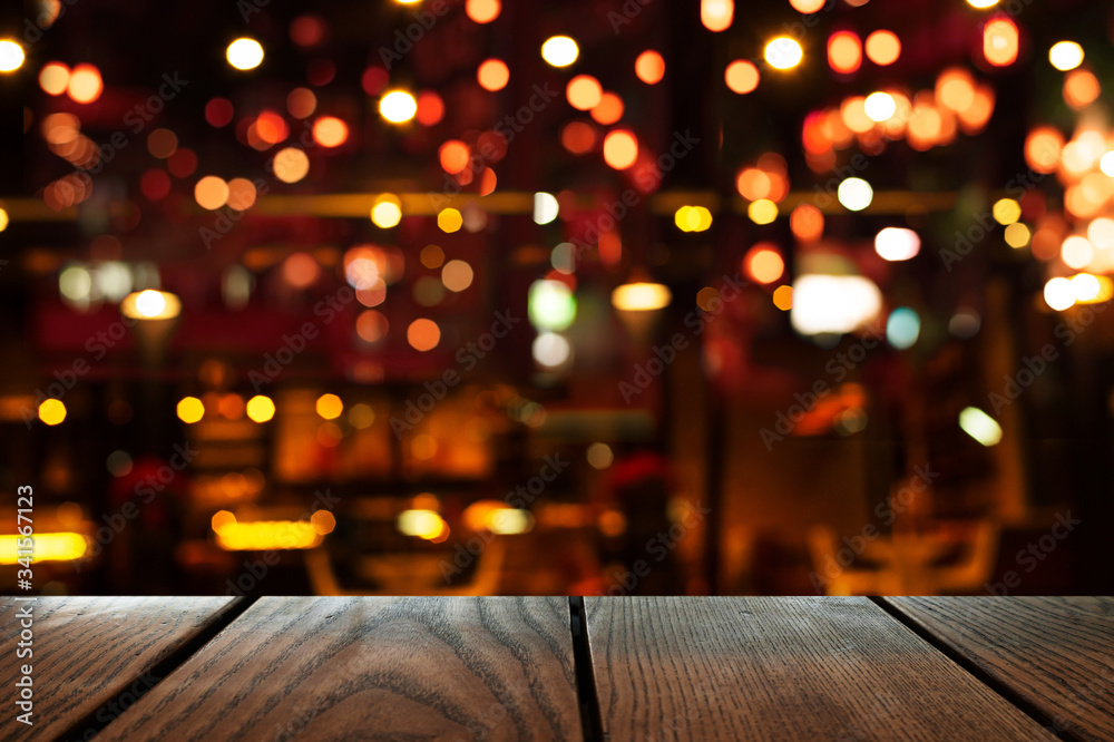blur bokeh of bar party dark night light background with wood table ...