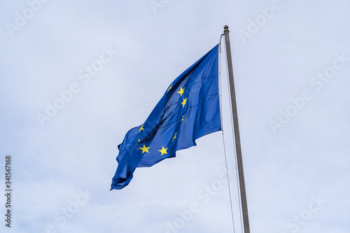 European Union flag on blue sky background in Rome
