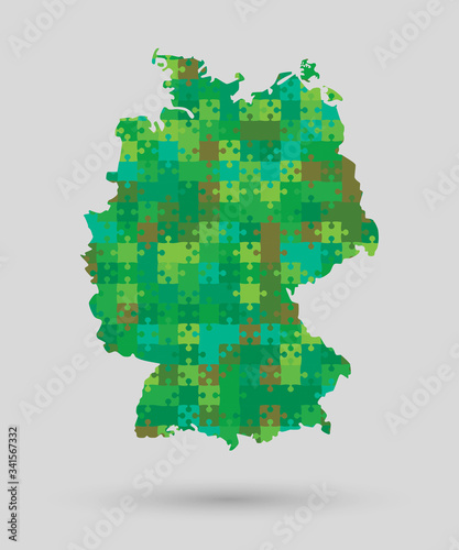 Germany map made green jigsaw puzzle pieces