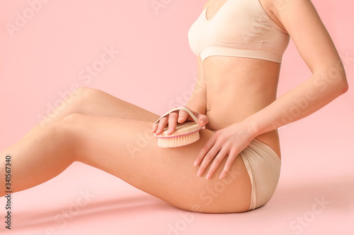 Wallpaper Mural Woman with anti-cellulite massage brush on color background Torontodigital.ca