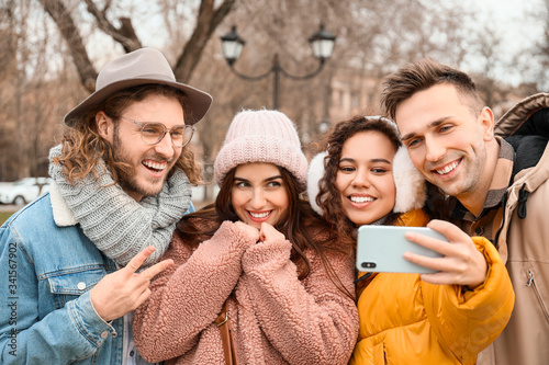 Happy friends taking selfie...