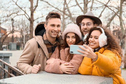 Happy friends taking selfie...
