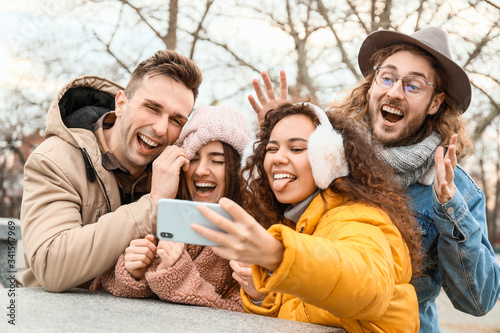 Happy friends taking selfie...