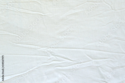 Crumpled white linen fabric cotton for wallpaper design. Brown weave cotton background texture.