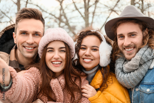 Happy friends taking selfie...