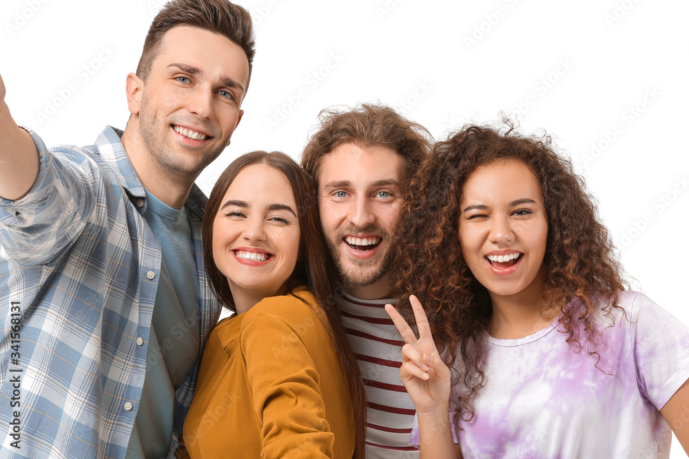 Friends taking selfie on white background Friends taking selfie on white background