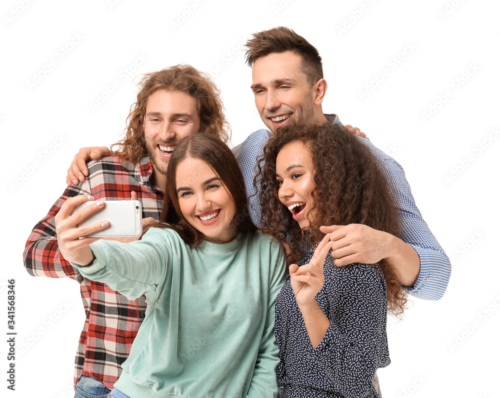 Fototapeta premium Friends taking selfie on white background