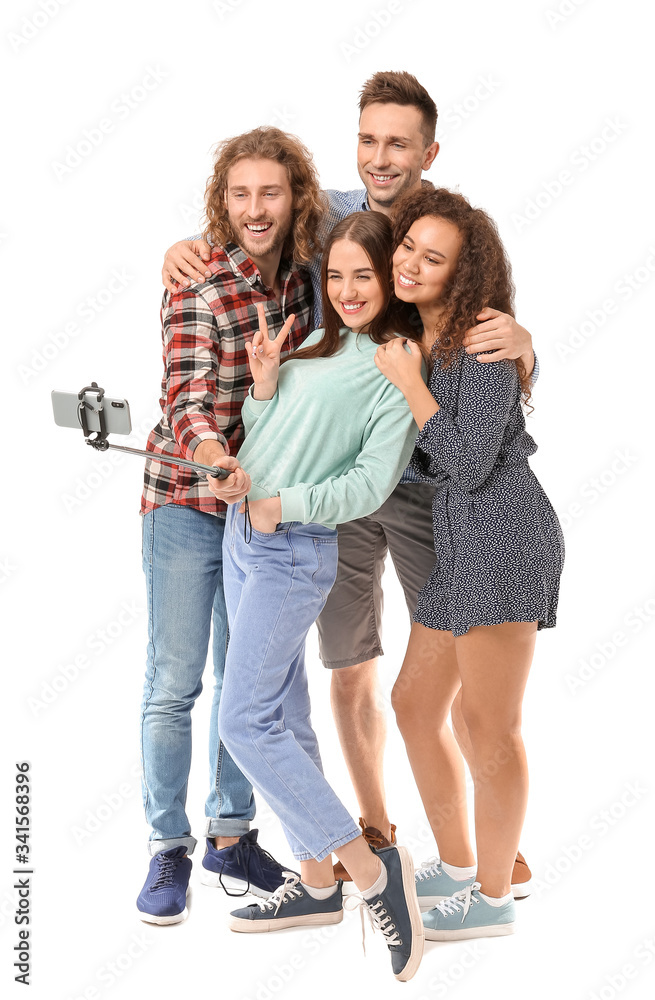 Fototapeta premium Friends taking selfie on white background