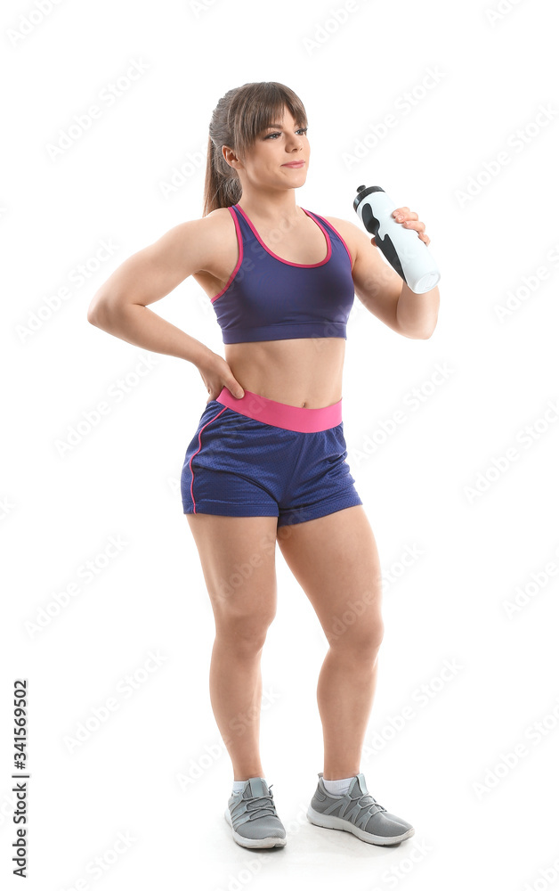 Sporty muscular woman with bottle of water on white background Sporty muscular woman with bottle of water on white background