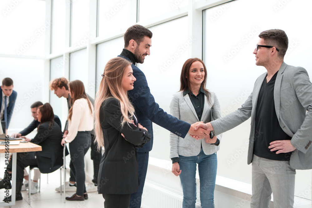 business colleagues greeting each other with a handshake business colleagues greeting each other with a handshake