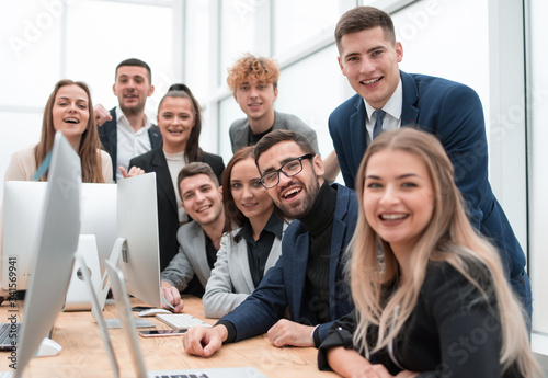 close up.a group of happy employees in the workplace