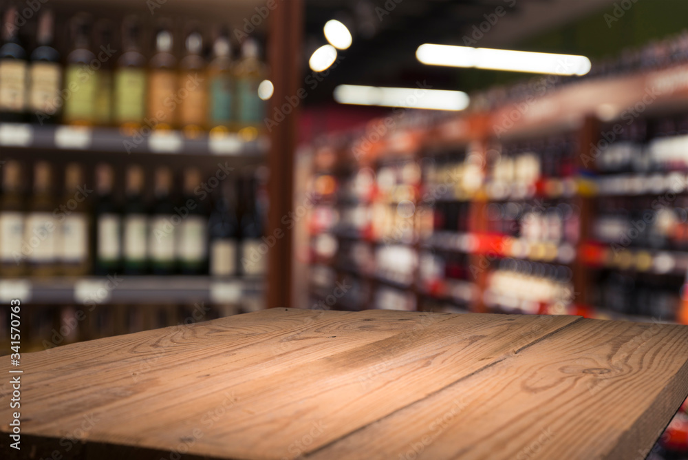 Supermarket background, Counter over blur grocery background, Wooden desk, table, shelf and blur woman shopping at supermarket, Wood counter for grocery store retail product display backdrop, template