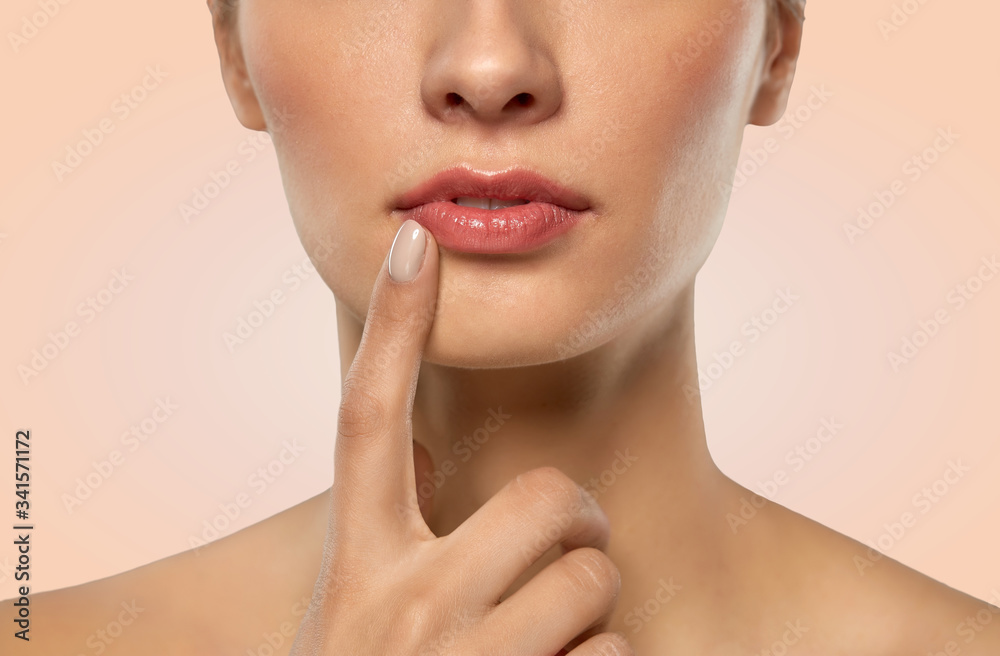 beauty, makeup and people concept - close up of beautiful young woman face and lips over beige background beauty, makeup and people concept - close up of beautiful young woman face and lips over beige background