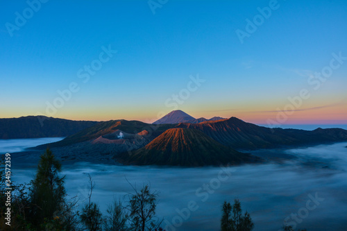 Mount Bromo  is an active volcano and part of the Tengger massif  in East Java  Indonesia