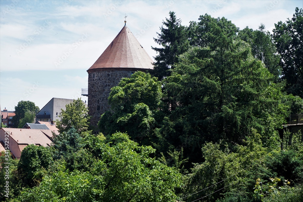The tower of the Gerberbastei Bautzen hidden behind trees