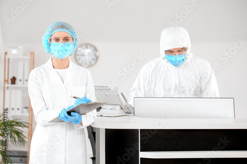 Receptionist with doctor in...