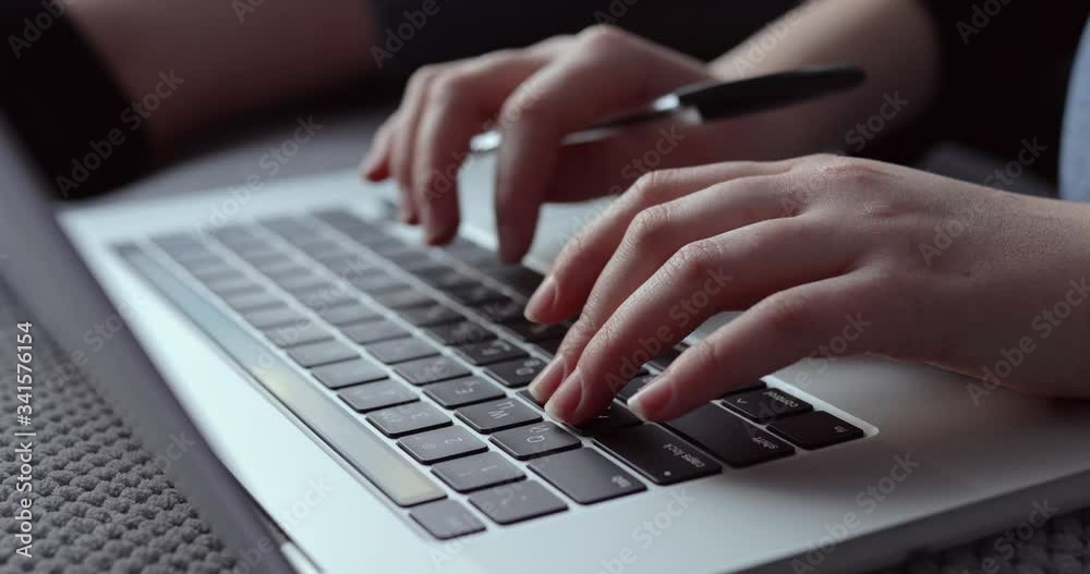 female hands typing on laptop keyboard. closeup. home atmosphere. female hands typing on laptop keyboard. closeup. home atmosphere.