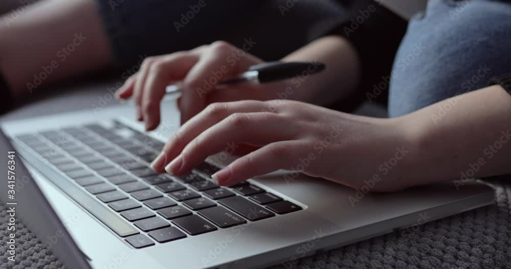 female hands typing on laptop keyboard. closeup. home atmosphere. female hands typing on laptop keyboard. closeup. home atmosphere.